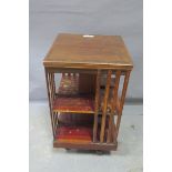 A MAHOGANY AND KINGWOOD CROSS BANDED REVOLVING BOOKSTAND,