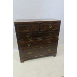 A GEORGIAN MAHOGANY AND SATINWOOD INLAID CHEST,