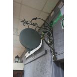 A WROUGHT IRON WALL MOUNTED SIGN,