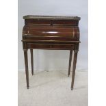 A FINE 19th CENTURY MAHOGANY PARCEL GILT AND GILT BRASS MOUNTED CYLINDER FRONT DESK,