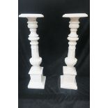 A PAIR OF VICTORIAN DESIGN CAST IRON CANDLE HOLDERS,