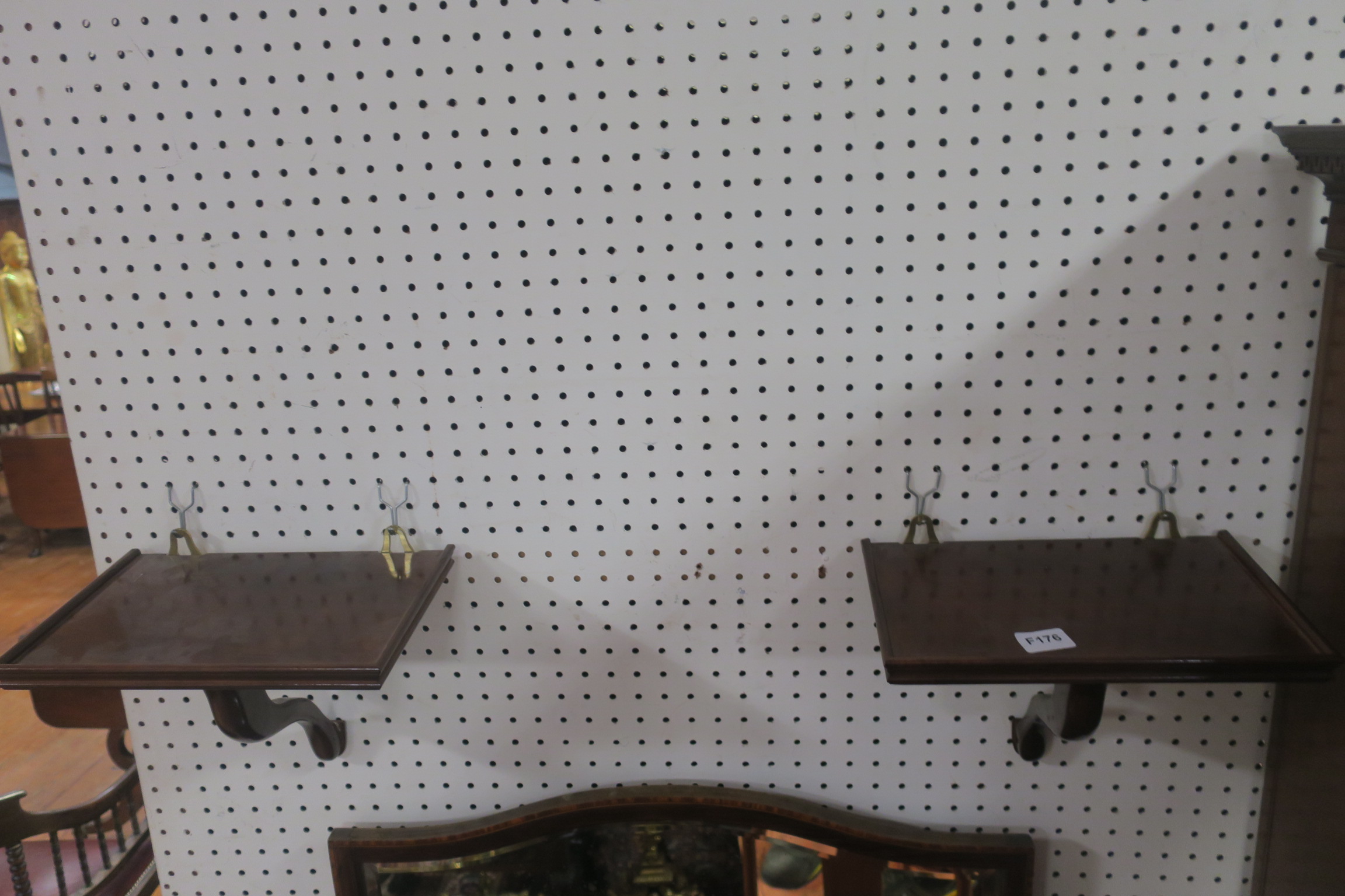 A PAIR OF MAHOGANY AND BRASS WALL BRACKETS,