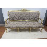A CONTINENTAL GILTWOOD SETTEE,