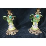 A PAIR OF CONTINENTAL PORCELAIN AND GILT BRASS FIGURAL CANDLESTICKS,