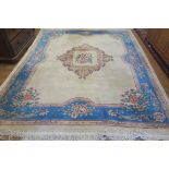 A GOOD CHINESE WOOL RUG, the beige,