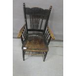 AN OAK SPINDLE BACK CHAIR,