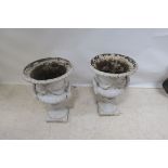 A GOOD PAIR OF 19th CENTURY CAST IRON URNS,