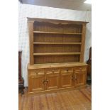 A PINE OPEN FRONT DRESSER,