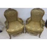 A PAIR OF CONTINENTAL GILTWOOD AND UPHOLSTERED ARMCHAIRS, each with shell,