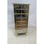 A CONTEMPORARY MIRRORED AND PARCEL GILT TALL BOY,