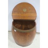 AN OAK AND BRASS BOUND BARREL,