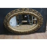 A GILTWOOD AND GESSO MIRROR,