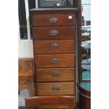 A GEORGIAN MAHOGANY TALL BOY of rectangular outline the shaped top above eight long drawers with