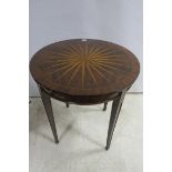 A CONTINENTAL WALNUT AND KINGWOOD CROSS BANDED OCCASION TABLE the circular sunburst top above a