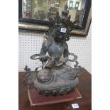 A CHINESE BRONZE FIGURE,
