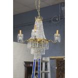 A CONTINENTAL GILT BRASS AND CUT GLASS FOUR BRANCH EIGHT LIGHT CHANDELIER,