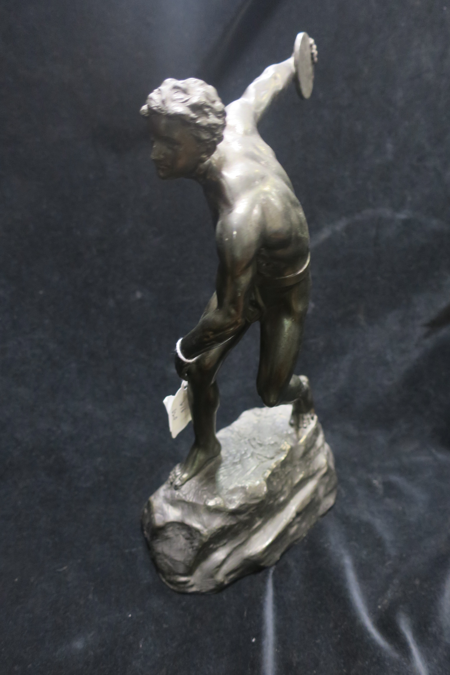 A BRONZE FIGURE,