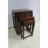 A NEST OF FOUR ROSEWOOD TABLES,