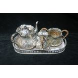 A THREE PIECE SILVER PLATED TEA SET,