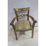 A CONTINENTAL GILTWOOD ELBOW CHAIR the carved top rail above a pierced splat with scroll uprights