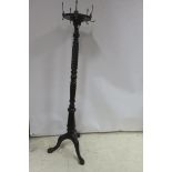 A 19TH CENTURY MAHOGANY COAT STAND the spiral twist and baluster column raised in carved tripod