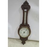 A 19TH CENTURY MAHOGANY CARVED CASE BANJO BAROMETER with porcelain dials 90cm(h)