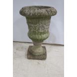 A COMPOSITION STONE URN,