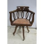 A MAHOGANY SWIVEL LIBRARY CHAIR,