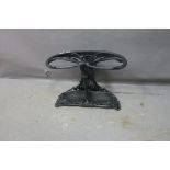 A CAST IRON FIVE SECTION STICK STAND,
