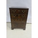 A 19TH CENTURY MAHOGANY CHEST of rectangular outline with four long graduated drawers on bracket