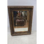 A CONTINENTAL GILTWOOD AND GESSO MIRROR,