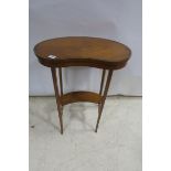 A 19TH CENTURY SATINWOOD AND ROSEWOOD CROSS BANDED OCCASIONAL TABLE of kidney shaped outline on