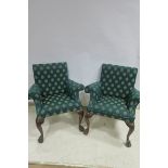 A PAIR OF CHIPPENDALE DESIGN MAHOGANY AND UPHOLSTERED ARMCHAIRS each with a rectangular back and