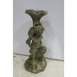 A COMPOSITION STONE FIGURE,