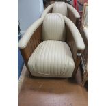 A VERY FINE PAIR OF ART DECO DESIGN CHERRYWOOD AND HIDE UPHOLSTERED TUB SHAPED CHAIRS each with a