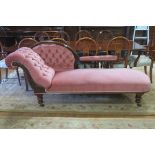 A 19TH CENTURY CARVED MAHOGANY AND UPHOLSTERED CHAISE LONGUE the shaped back with button