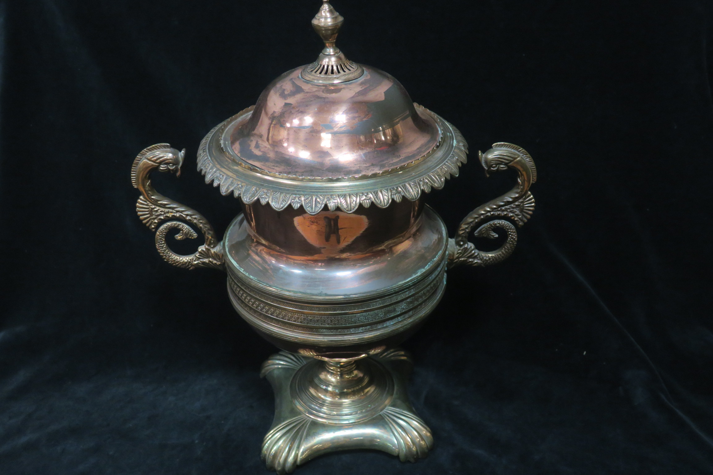 A 19th CENTURY COPPER AND BRASS LIDDED URN,