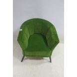 A RETRO GREEN VELVET UPHOLSTERED TUB SHAPED CHAIR,