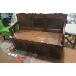 AN ARTS AND CRAFTS MAHOGANY SEAT,