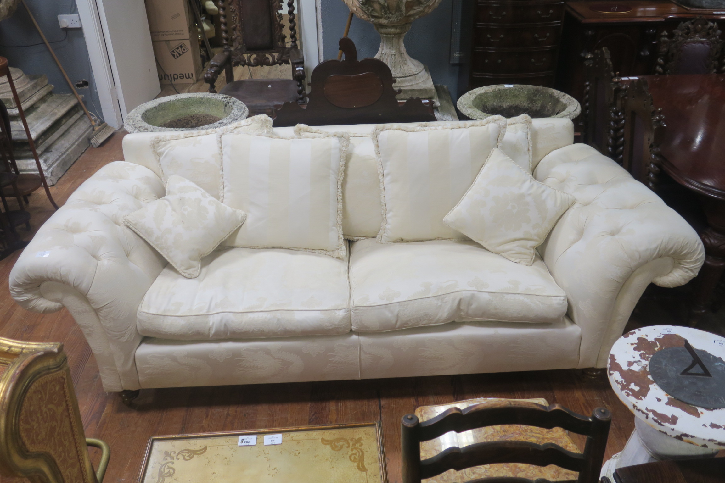 A FINE VICTORIAN DESIGN SETTEE the rectangular back with buttoned scroll over arms and loose