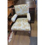 A 19TH CENTURY WALNUT AND UPHOLSTERED ELBOW CHAIR with upholstered back and seat and arm rest