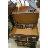 A RETRO LEATHER SUITCASE with brass clasps