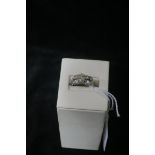 AN 18 CT WHITE GOLD DRESS RING, 1.