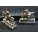 A FINE PAIR OF BRASS BRONZE AND CAST IRON DOOR STOPS each modelled as a lion shown standing with