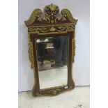 A CONTINENTAL GILTWOOD AND MAHOGANY MIRROR,