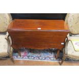 A 19TH CENTURY MAHOGANY DROP LEAF TABLE of serpentine outline the shaped top with satinwood inlay