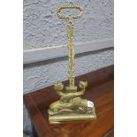 A 19th CENTURY BRASS DOOR STOP,