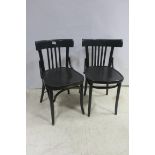 A SET OF SIX EBONISED BENTWOOD CHAIRS each with a curved back and vertical splats with shaped seats