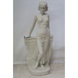 A SIMULATED MARBLE FIGURE,