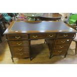 A CONTINENTAL KINGWOOD WALNUT CROSS BANDED DESK,